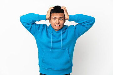 Fototapeta premium Young Ecuadorian man isolated on white background doing nervous gesture