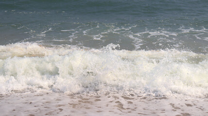 beautiful beach and sea waves and water droplets