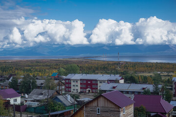 Fototapeta na wymiar Evening landscape of the city of Nizhneangarsk and Lake Baikal