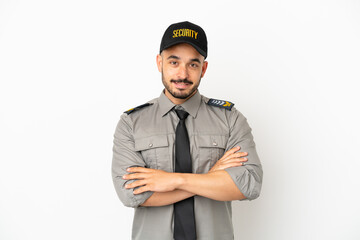 Young security  caucasian man isolated on white background keeping the arms crossed in frontal position
