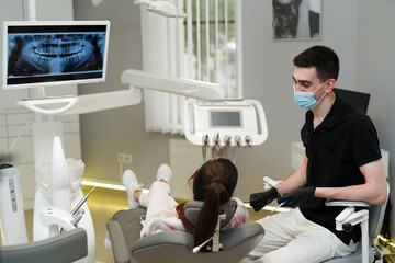Man dentist teeth healthcare. Dental young specialist in mask with patient.