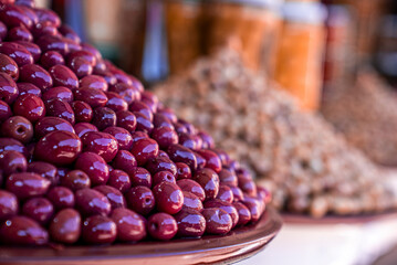 Pile of Olea europaea or Olive for sale at local street bazaar in Marrakech