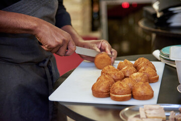 chef cutting bread for tapas