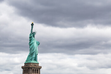 Statue of Liberty on a cloudy day as background image, New York City, USA