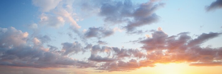 Clear blue sky with glowing pink and golden clouds after the storm. Dramatic sunset cloudscape. Concept art, meteorology, heaven, hope, peace. Graphic resources, picturesque panoramic scenery