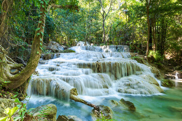Erawan National Park  in Thailand. Erawan Waterfall is a popular tourist destination and famous for its emerald blue water. Deep forest in tropical climate with fantasy atmosphere. 
