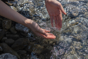 Woman with backpack riverside