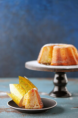 Roscon de Reyes traditional spanish cake for Epiphany festivites. Epiphany cake with candied fruits, crown. Blue background