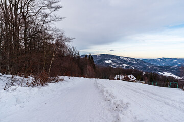 Obraz premium View from Velky Sosov hill in winter Slezske Beskydy mountains on czech - polish borders