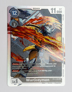 Hamburg, Germany - 12242021: picture of the english Digimon card WarGreymon from the Classic Collection EX01 series with nice light effect to show the paper surface.