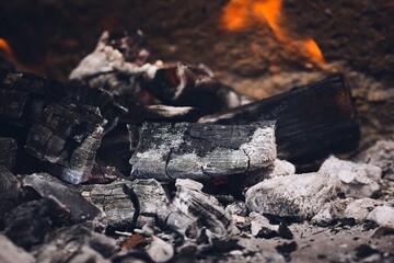 Smoldering embers and ashes in a bonfire. Close up.