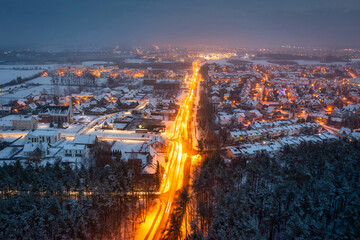 Aerial landscape of small village at dusk covered with fresh snow