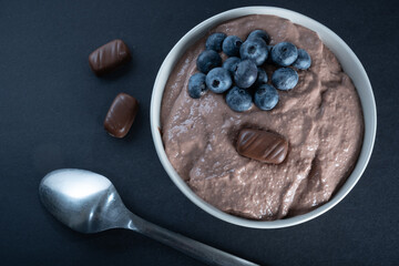 Traditional Finnish foods: Overhead shot of a bowl of chocolate porridge with blueberry topping