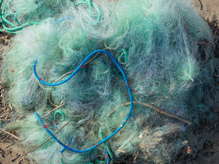 tangled fishing nets  symbol of pollution and sealife problems - 477758831
