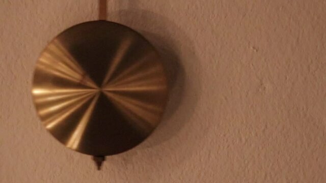 clock pendulum in swing motion