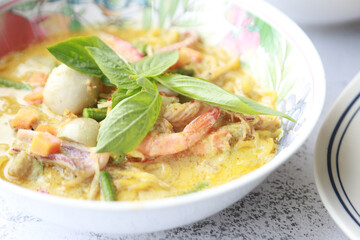 Green curry noodle soup with seafood raw, fish meatball, boil shrimp. favorite Spicy food in Thailand and Asian