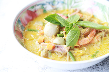 close up noodle with green curry soup and fish meatball and shirmp, Thai tradition spicy food in Asian