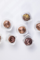 Homemade dark chocolate truffles. Delicious chocolate dessert on white