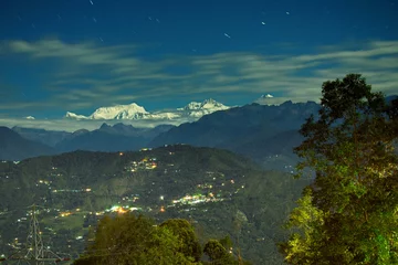 Photo sur Plexiglas Kangchenjunga Beautiful view of moonlit Kanchenjungha Mountain Range of great Himalayas, shot in a full moon night. Rinchenpong, Sikkim, India