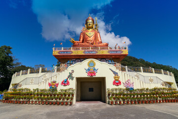 Samdruptse statue , a huge buddhist memorial statue in Sikkim, blue cloudy sky in background.