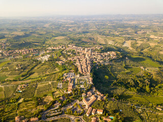 Obraz premium Aerial/Drone panorama of San Gimignano in the tuscany and its vineyards and olive trees, Tuscany Italy 