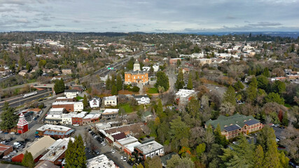 Downtown Old Auburn California with view of the Sierra Nevada Mountains. The Old Courthouse was recently renovated and is still a functioning government building.  - obrazy, fototapety, plakaty