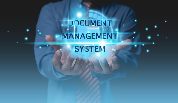 DOCUMENT MANAGEMENT SYSTEM. Businessman holding digital folder icon corporate files and information on hands. Technology digital internet online keep documents business for security.