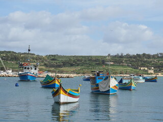 Fototapeta na wymiar Marsaxlokk is a small, traditional fishing village in Malta