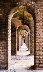 Fort Jefferson, Dry Tortugas National Park, Florida Keys. Brick arches Gunrooms known as casemates, form a honeycomb of brick masonry arches. Linear or geometric perspective to the vanishing point. 