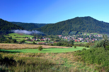 View of Uscie Gorlickie - village in the Beskid Niski by the Klimkowka Lake, Poland - obrazy, fototapety, plakaty