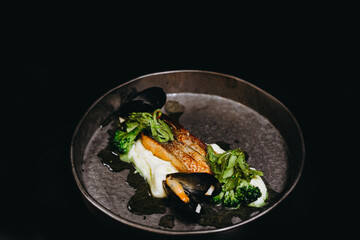 The dish is finally finished and the mussels improves the dish.