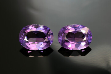 USSR era lab created synthetic alexandrite gemstones pair. Purple color, oval faceted, transparent common vintage gems removed from used earrings made in Russia. Mass market man made stones. Rare now.