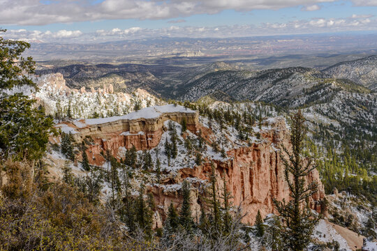 Snow covered Hoodoo's and cloud shadows in the valley.