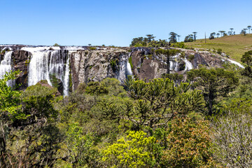 Obraz premium Waterfall with fields and forest around