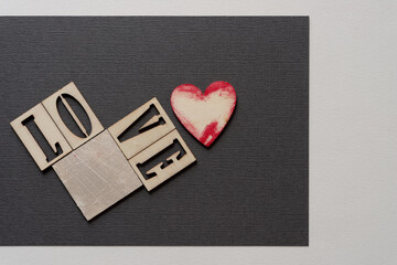 the word love with a square tile and grungy heart