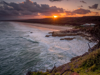 Coastal Sunset with Rocky Headland