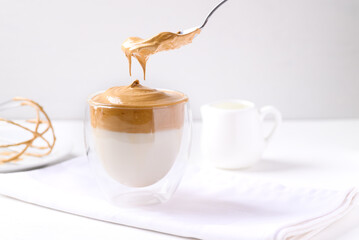 Dalgona coffee, Fluffy cream coffee whipping on cold or hot milk, Korean coffee style, Homemade food