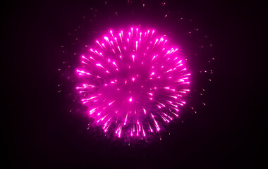 Purple fireworks explode in the air against the night sky, illuminating the sky of the city on New...