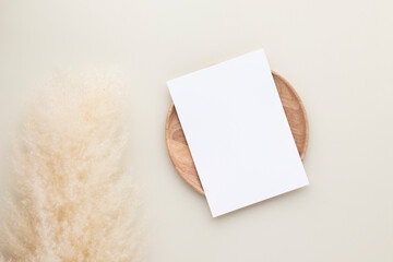 Blank paper cards, Mockup with pampas grass on a wooden plate, beige background, Minimal beige...