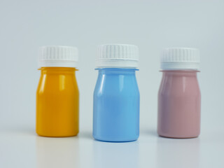 pigment resin paint in the bottle, many colors have pink, blue, and orange.