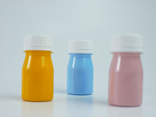 pigment resin paint in the bottle, many colors have pink, blue, and orange.