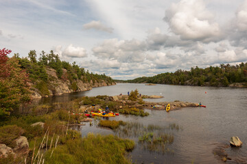 Kayakers at a campsite on the Key River  up stream from Key Harbour on Georgian Bay in Northern Ontario, Canada