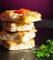 Fresh baked focaccia with cherry tomato, poppy and sesame seeds, pepper, Himalayan rock salt and mixed herbs. 