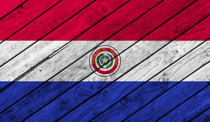 Naklejka premium Paraguay flag on wooden background. 3D image
