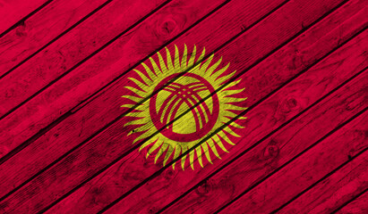 Kyrgyzstan flag on wooden background. 3D image