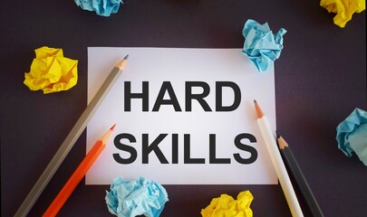 HARD SKILLS text written on white paper,Pencils over white paper, crumpled papers page, dark...