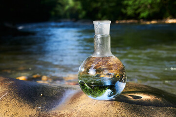 Flask with clear river water.