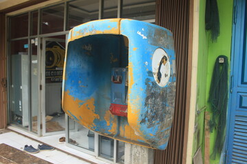 public telephone booths that are still standing on the side of the highway, these telephone booths...
