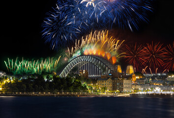 Sydney Harbour Bridge New Years Eve fireworks, colourful fire works lighting the night skies with vivid multi colours