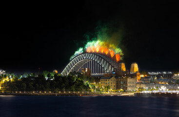 Obraz premium Sydney Harbour Bridge New Years Eve fireworks, colourful fire works lighting the night skies with vivid multi colours